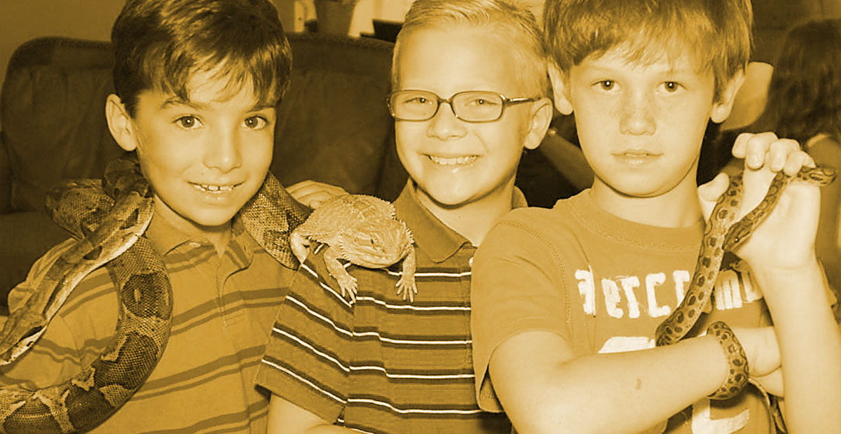 Young kids enjoying a reptile party at home