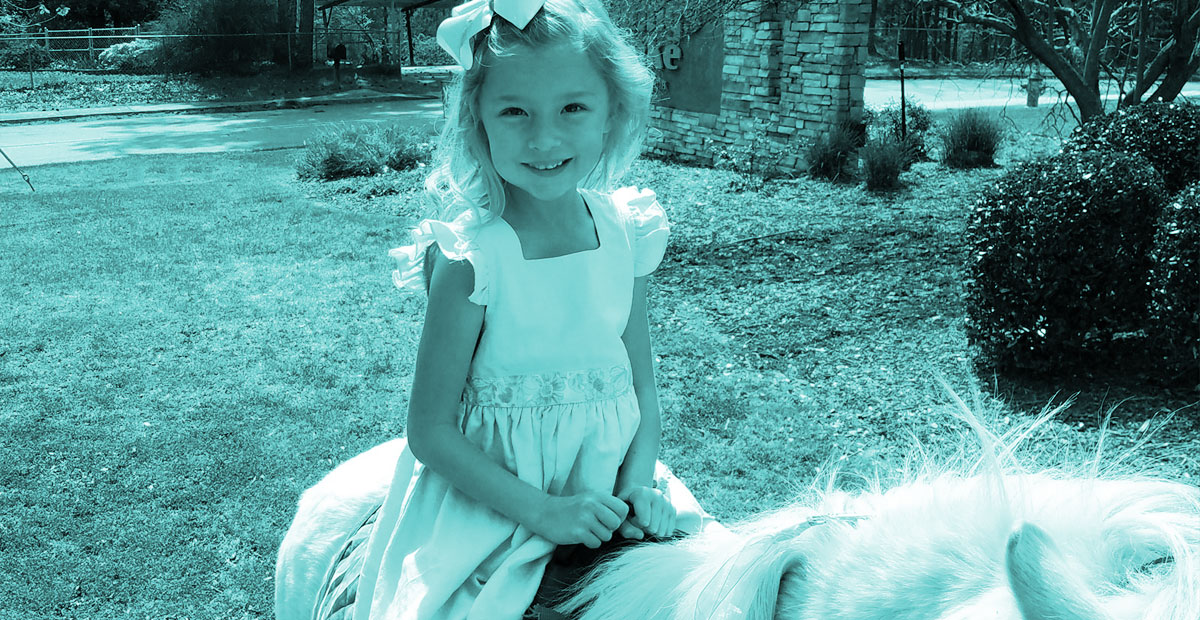 A girl ridding a pony at her birthday party
