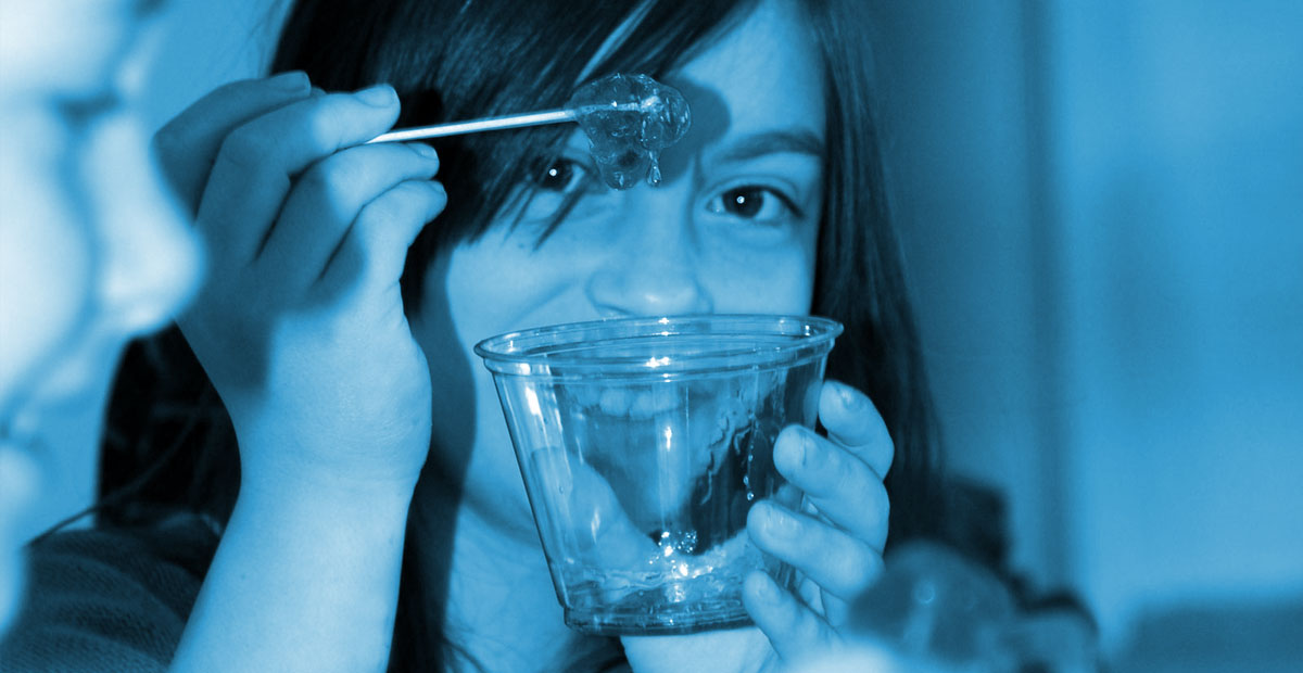 A young child having fun at the science birthday party
